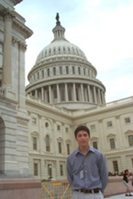 Stephen Vigil stands in front of the U.S. Capitol