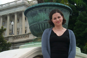 Victoria Tishman standing next to a pot on the Capitol stairs