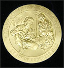 Color photograph showing a close up of the first Congressional Gold Medal, a coin-shaped medal with an embossed profile of George Washington, who faces right.
